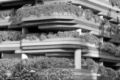 A high rise building with overflowing greenery